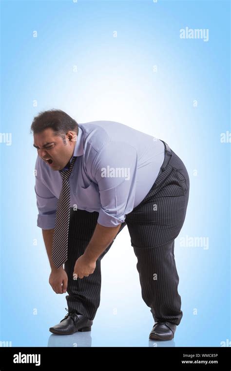 fat guy bending over|1,000 Man Bending Over Stock Photos